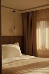 Postel nebo postele na pokoji v ubytování Boutique Hotel Panorama