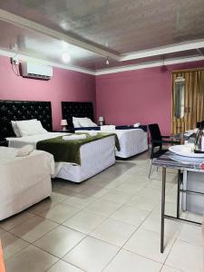 Ένα ή περισσότερα κρεβάτια σε δωμάτιο στο AA Nkhumeleni Guesthouse and Accomodation