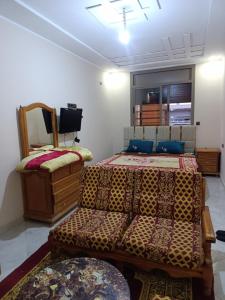 En eller flere senge i et værelse på Studio au deuxième étage, résidence almohade