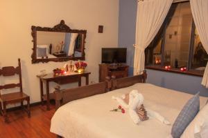 Postel nebo postele na pokoji v ubytování El Refugio Hotel & Spa