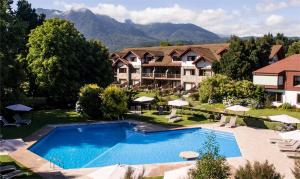 an aerial view of a resort with a swimming pool at Hotel Pucon Green Park in Pucón
