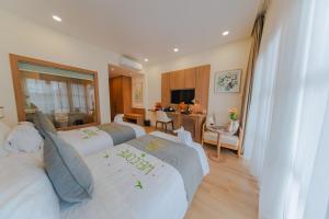 Ένα ή περισσότερα κρεβάτια σε δωμάτιο στο Villa Oasis Luang Prabang