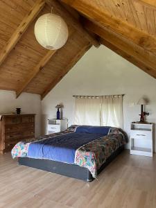 En eller flere senge i et værelse på Aldea Aventur