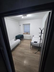 Postel nebo postele na pokoji v ubytování Apartament Wrocławska 11