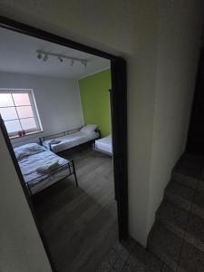 Postel nebo postele na pokoji v ubytování Apartament Wrocławska 11