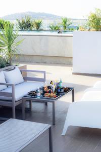 a tray of food on a coffee table on a patio at DIAGONAL HOTEL in Tangier