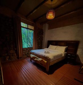 Giường trong phòng chung tại Hotel El Rancho