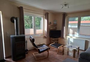 Et tv og/eller underholdning på Ferienhaus nahe der Müritz