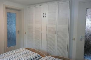 Postel nebo postele na pokoji v ubytování Ferienhaus Fleesensee