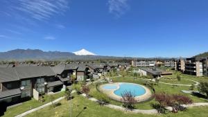an aerial view of a resort with a swimming pool at Departamento Costa Pucón in El Cerrillo