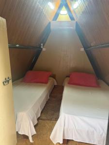 Postel nebo postele na pokoji v ubytování Pousada Recanto da Estação