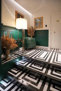 a living room with a black and white floor at Duse Luxury Stay in Milan +66 photos
