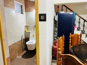 Koupelna v ubytování Sidhi Vinayaka Homestay + 3 fotografie