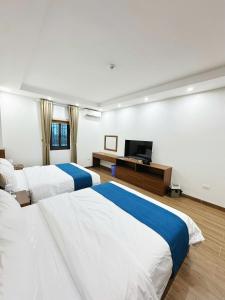 En eller flere senge i et værelse på Chenghotel + 4 billeder