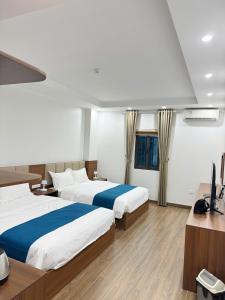 En eller flere senge i et værelse på Chenghotel