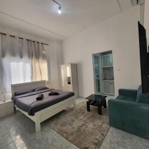 Giường trong phòng chung tại DIsnip Full Apartments