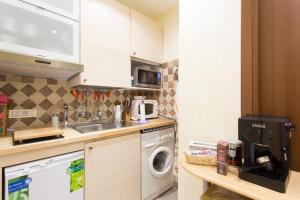 a kitchen with a sink and a washing machine at Apartment n3 in City Centre in Rome