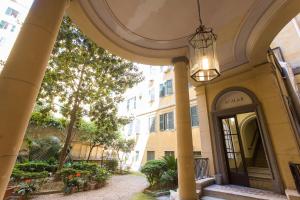 an entrance to a building with a chandelier at Apartment n3 in City Centre in Rome