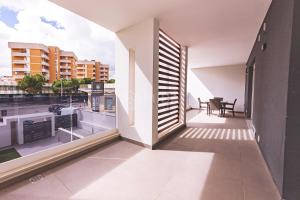 een balkon met uitzicht op de stad bij VITTO Luxury Apartment in Lecce