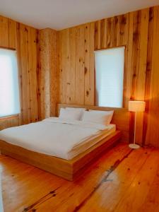 En eller flere senge i et værelse på บ้านพัก กามู ดอยอินทนนท์ Gamoo + 17 billeder