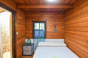 En eller flere senge i et værelse på L'Vinia Charming Rural House