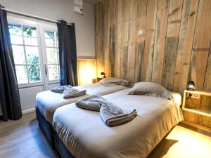 En eller flere senge i et værelse på Au ptit Tchestê + 37 billeder