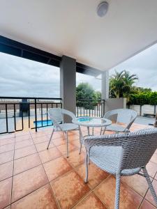 En balkon eller terrasse på Palms Guest House