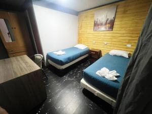 Giường trong phòng chung tại Hotel Gala