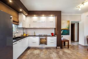 Nhà bếp/bếp nhỏ tại Sunny Exclusive Tria