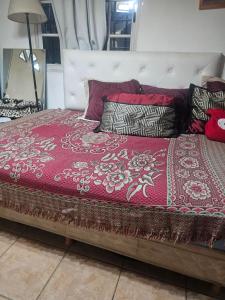 En eller flere senge i et værelse på Casa compartida en Munro