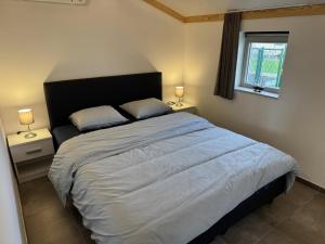 Giường trong phòng chung tại Westhinder II H23