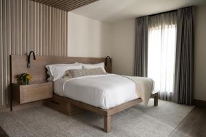 Postel nebo postele na pokoji v ubytování Seven Beach Lane