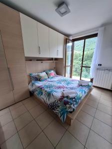 En eller flere senge i et værelse på Residenza Coccinelle vista Lago d'Iseo + 46 billeder