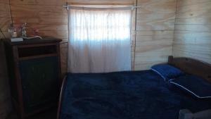 Giường trong phòng chung tại Gitana +2 ảnh