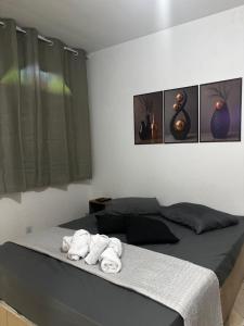 En eller flere senge i et værelse på Pousada Familia