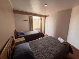 Postel nebo postele na pokoji v ubytování Hostal La Reserva - Pisco