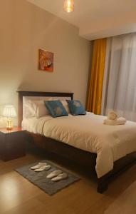 En eller flere senge i et værelse på Penta Homes