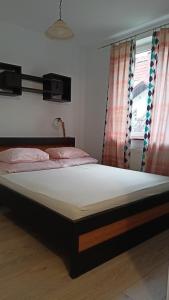 En eller flere senge i et værelse på Apartament w Giżycku przy plaży