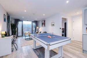 a living room with a ping pong table in it at Birmingham City centre, Pool table, Spacious in Birmingham
