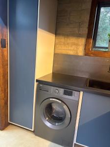 a washing machine in a kitchen with a counter at Bosch Rest in Pretoria