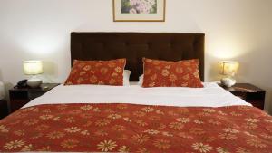 Кровать или кровати в номере Hotel termas de Panimávida resort & spa +12 фотографий