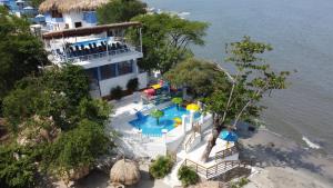 an aerial view of a resort with a swimming pool at Santorini Kima Beach Resort in Santa Marta