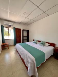 Кровать или кровати в номере Hostal Punta Arena