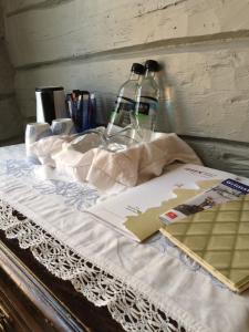 a bed with pillows and a blanket on top of it at Gjestehuset IBSEN in Grimstad