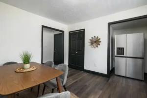 a dining room with a wooden table and chairs at 3BR Downtown-Old Salem Oasis in Winston-Salem +11 photos
