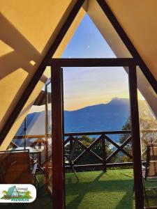 a view from the inside of a tent with a window at Chalet Maranatha Vista Única Represa de Chivor in Macanal