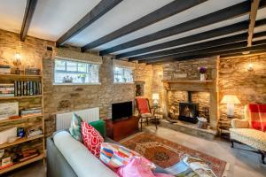 a living room with a couch and a fireplace at 2 Bed in Melkridge oc-b32221 in Haltwhistle