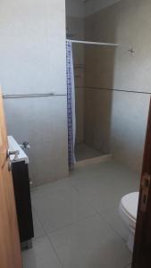 a bathroom with a shower and a toilet at dpto SanLuis in Valeria del Mar +11 photos