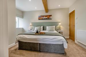 a bedroom with a large bed with a tray on it at 1 Bed in Montgomery oc-w33744 in Montgomery