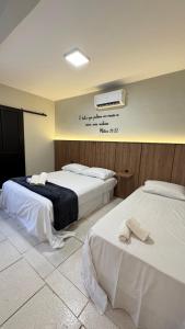 En eller flere senge i et værelse på Guest House Suite Renovo + 24 billeder